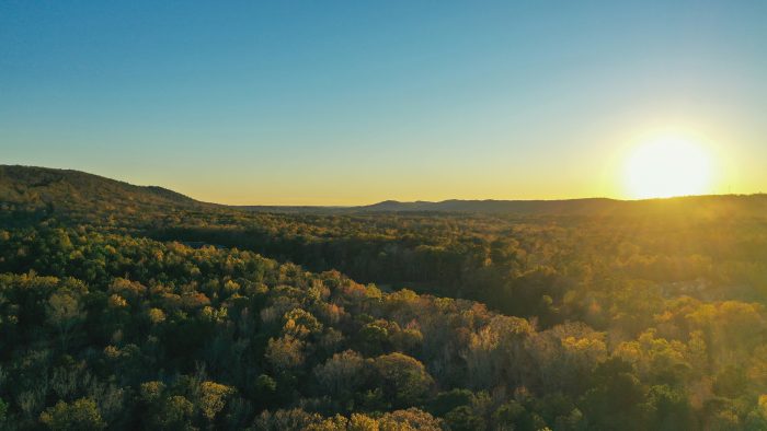 Sunset over rolling hills in Alabama. Photo by Josh Pigford.